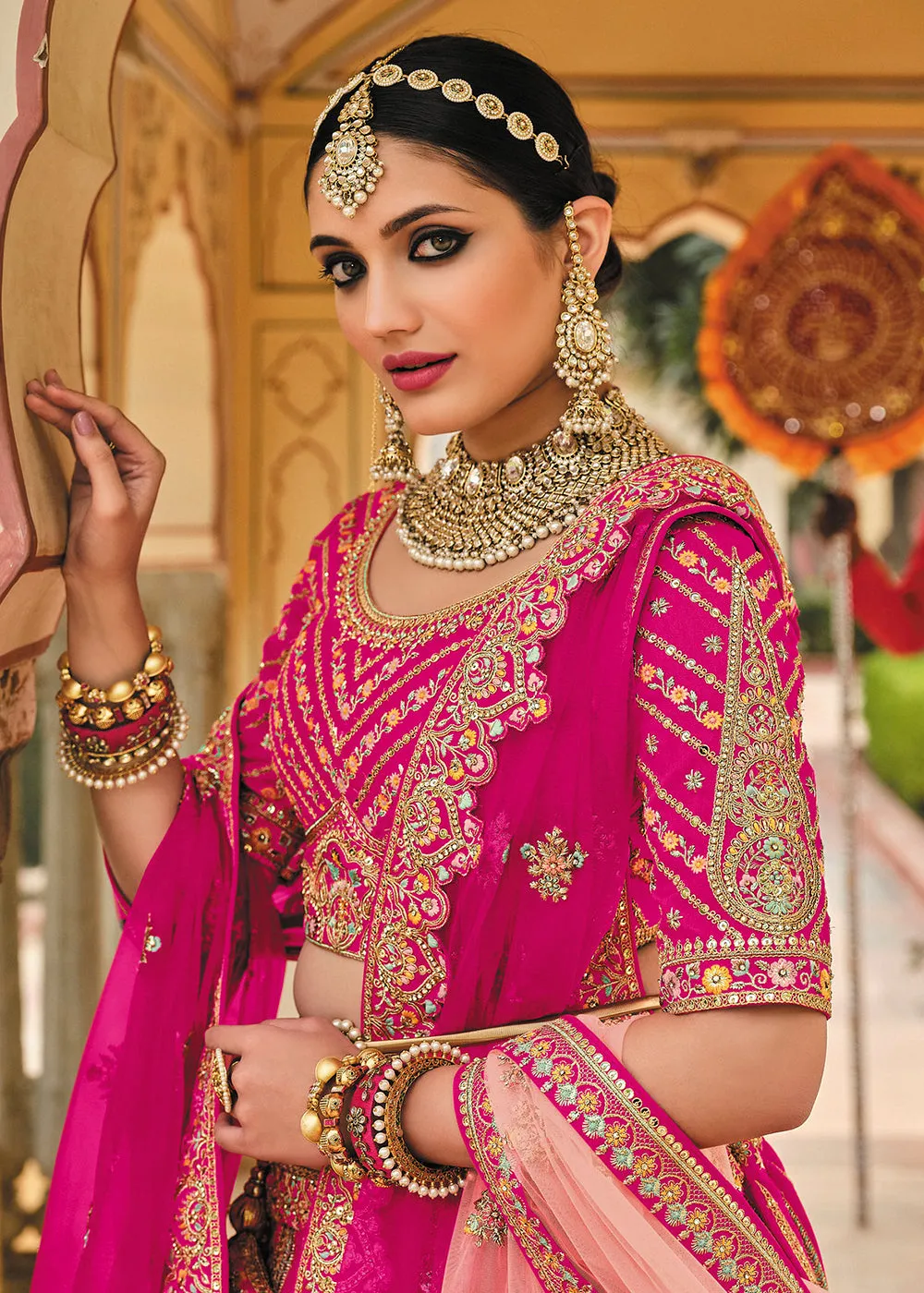 Enticing Pink Bridal Wear Heavy Embroidered Silk Lehenga Choli